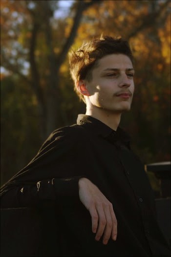 Photo of Man Wearing Black Top