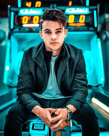 Photo of Man Wearing Black Zip-up Jacket