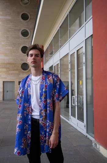 Photo Of Man Wearing Blue Floral Polo