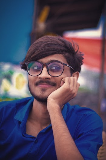 Photo of Man Wearing Blue Polo Shirt