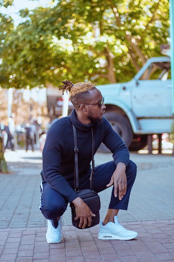 Photo of Man Wearing Blue Sweater