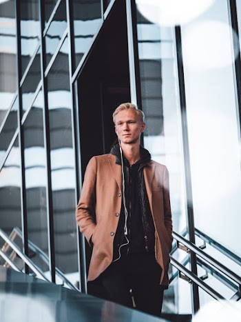 Photo Of Man Wearing Brown Coat