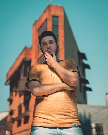 Photo of Man Wearing Brown Shirt