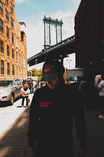 Photo of Man Wearing Cap and Hoodie