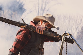 Photo of Man Wearing Cowboy Hat 