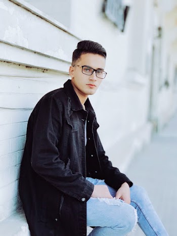 Photo of Man Wearing Denim Jacket