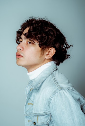 Photo of Man Wearing Denim Jacket