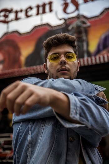 Photo of Man Wearing Denim Jacket