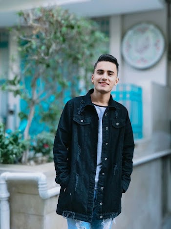 Photo of Man Wearing Denim Jacket