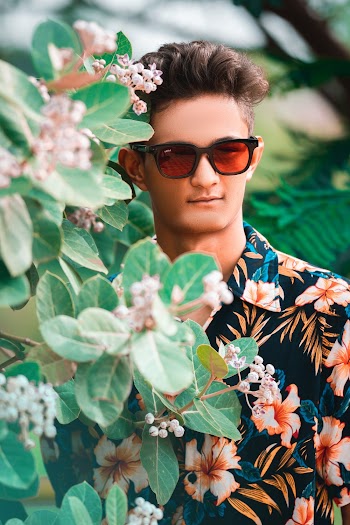 Photo of Man Wearing Floral Top