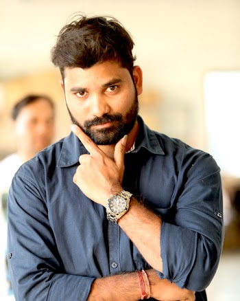Photo of Man Wearing Gray Button-up Shirt With Analog Watch