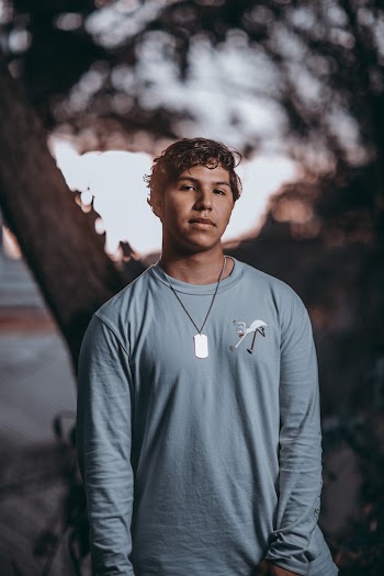 Photo Of Man Wearing Gray Sweaters