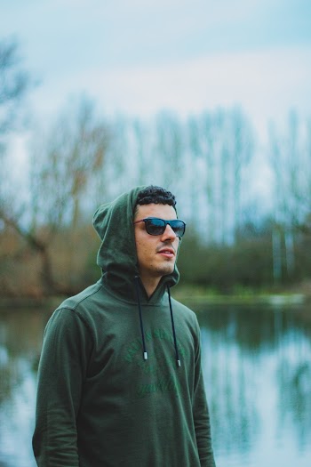 Photo of Man Wearing Green Hoodie