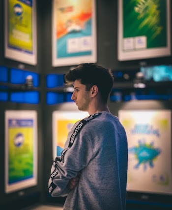 Photo of Man Wearing Grey Sweater