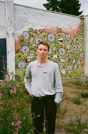 Photo of Man Wearing Grey Sweater