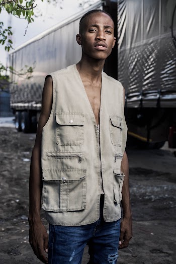 Photo Of Man Wearing Grey Vest