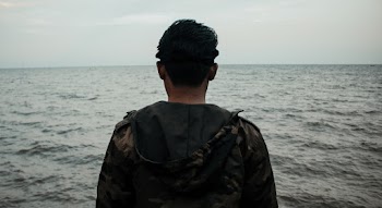 Photo of Man Wearing Hooded Jacket