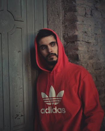 Photo of Man Wearing Hoodie