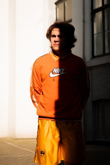 Photo Of Man Wearing Nike Sweater · Free Stock Photo