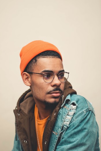Photo of Man Wearing Orange Beanie