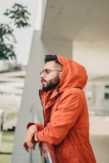 Photo of Man Wearing Orange Jacket