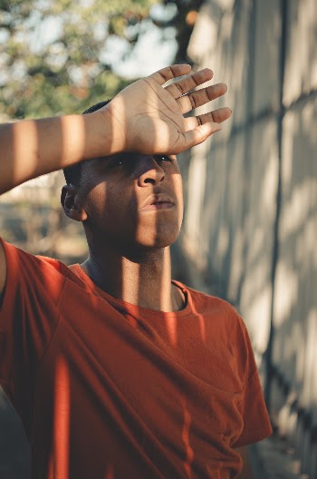 Photo Of Man Wearing Orange Shirt 