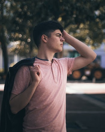 Photo of Man Wearing Pink Shirt