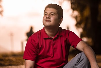 Photo of Man Wearing Red Polo Shirt