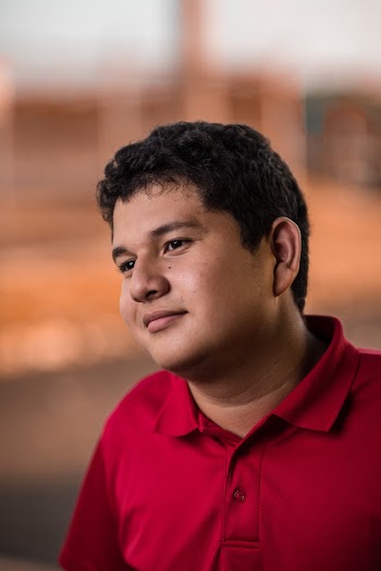 Photo Of Man Wearing Red Polo Shirt