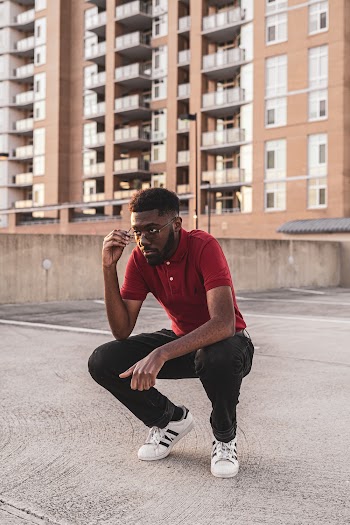 Photo of Man Wearing Red Polo Shirt