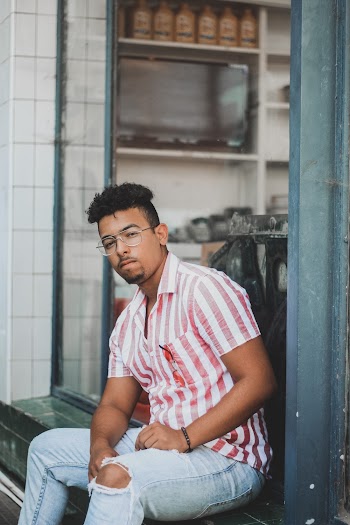 Photo Of Man Wearing Striped Polo Shirt