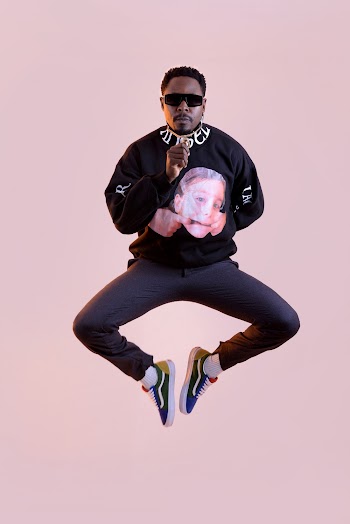 Photo of Man Wearing Sunglasses on Purple Background