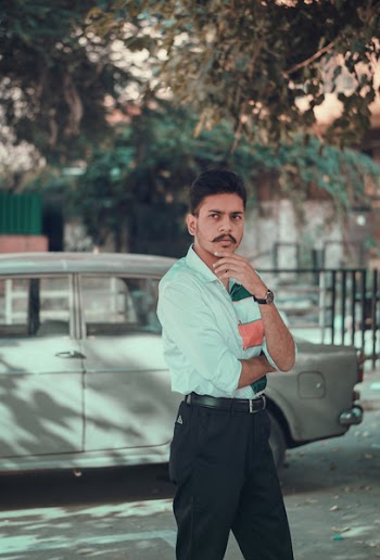 Photo of Man Wearing Teal Shirt