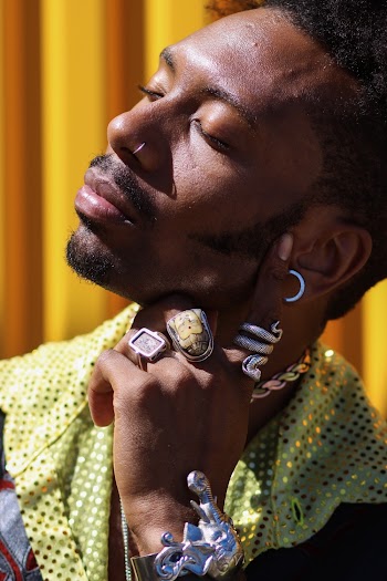 Photo Of Man Wearing Three Rings