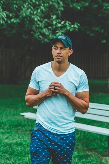 Photo of Man Wearing V-neck T-shirt