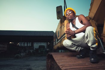 Photo of Man Wearing White Tank Top