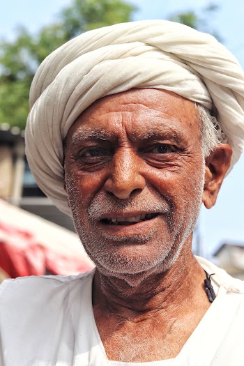Photo Of Man Wearing White Turban Hat 