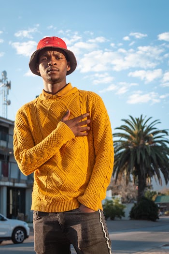 Photo of Man Wearing Yellow Sweater