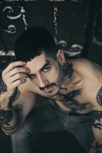 Photo of Man With Tattoos