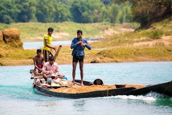 Photo of Men on Motorboat