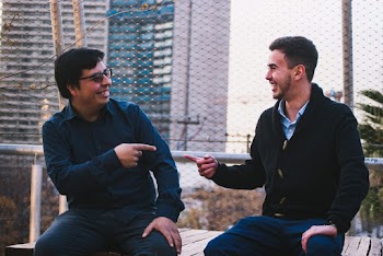 Photo of Men Pointing To Each Other