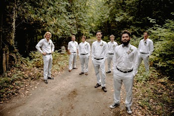 Photo of Men Standing on Dirt Road