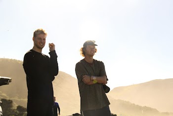 Photo of Men Standing While Wearing Black and Gray Top