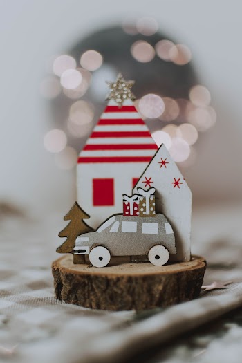Photo Of Miniature Houses On Toy Of Wooden Log