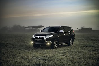 Photo of Montero Sport Parked on Grass Field