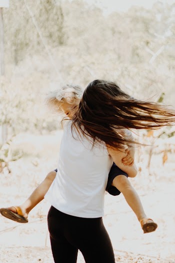 Photo of Mother and Child Playing 