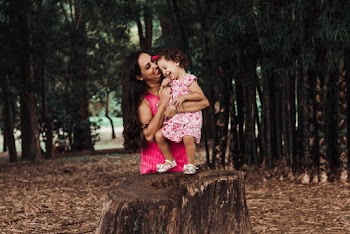 Photo Of Mother Holding Her Child 
