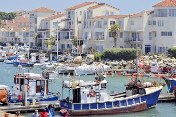 Photo of Motor Boats Docked at the Pier