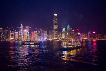Photo of Motorboats on River During Nighttime