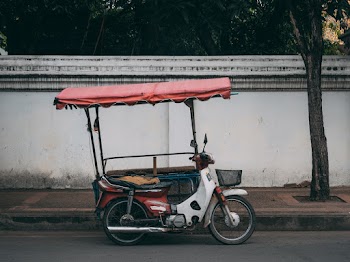 Photo of Motorcycle Parked Near Sidewalk